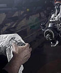 Close-up of mechanic using 40mm Wheel Bearing Greaser Kit For Polaris ATVs UTVs And SxS Must Have Quick Grease Packer For Bearings