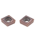 Two CCMT060204 carbide inserts for the Premium Lathe Turning Tool Set With SCMCN1010H06 Holder, used in precision metal cutting.