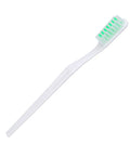 White toothbrush with soft bristles for gentle dental care and cleaning, featuring a green grip.