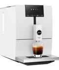 Lock In The Ultimate Morning Perk Up With This Factory Refurbished Automatic Coffee Machine In Sharp Nordic White with a cup of coffee.