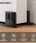Set Of Four Sliding Barn Door Bottom Floor Guides With Double Sided Roller Design For Smooth Quiet Operation In Durable Aluminum Alloy Floor Mounted Black Finish Ideal For Farmhouse Modern Or Industrial Interior Doors, floor mounted view.