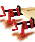 Red BPC-H34 3/4-in H-style pipe clamps clamping a wooden board (two shown).