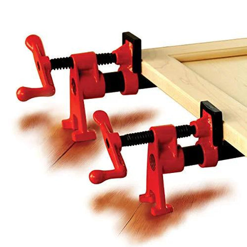 Red BPC-H34 3/4-in H-style pipe clamps clamping a wooden board (two shown).