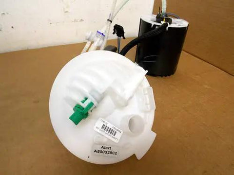 New Genuine Engine Fuel Pump For Land Rover LR2 Range Rover Sport Direct Fit Replacement LR038599 Heavy Duty Electric Inline Unit close-up view showing inlet and outlet connections.