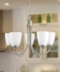 Five Light Etched Glass Traditional Chandelier In Brushed Nickel From Gather Collection, close-up in cozy dining room setting.