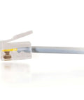 Close-up of RJ11 Modem Cable For Landline Phones And DSL Modems No Frills 7 Foot Silver Telephone Cable With RJ11 Male Connectors On Both Ends