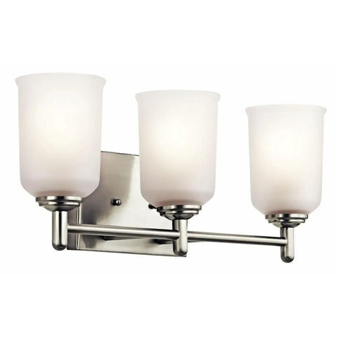Three Light Vanity Light Fixture With Satin Etched Glass Shades In Olde Bronze, mounted on wall, durable steel construction.