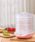 Slick Digital Food Dehydrator Featuring Five Stackable Trays Adjustable Heat Control Plus Solid Forty Eight Hour Timer with fruits on display.