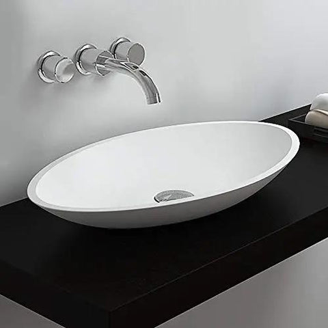 Top Shelf White Oval Vessel Vanity Sink Solid Artificial Stone Above Counter Bowl Basin with drain on dark counter.