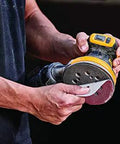 Hands holding 20V Max Brushless Orbital Sander Tool Only With Variable Speed Control 8000 To 12000 OPM Low Profile Body Close Work