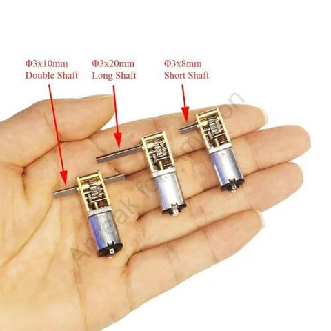 Three mini DC gear motors with different shaft types, double, long, and short, in silver housings for DIY projects
