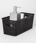 No Sweat Home Organization Decorative Storage Basket For Cube Systems And Desk Shelves, Sturdy Plastic Woven Organizer With Total Game Changer And Clean Setup Vibes In Sleek Black Medium holding a soap dispenser and cup.