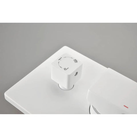 Close-up of control knob for Shower System with Waterfall Rainfall and Handheld, featuring directional icons.