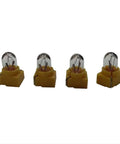 Dr.Speedometer GM stepper motor repair kit components: four yellow-base glass bulbs (front view)