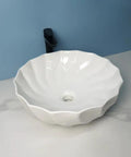 USZWBY Vessel Sinks Modern Minimalist Hotel Washroom Above Basin Bathroom Round Washbasin Ceramic Vessel Sink Bathroom Bowl Sink with a fluted design.