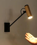 Adjustable Swing Arm Wall Lamp Heavy Duty Metal Bedside Light Modern E14 Wall Sconce for Bedroom with black metal arm and gold shade.