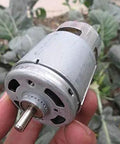 Badass 12 Volt 775 Series Dc Motor High Speed Heavy Duty Carbon Brush Design Delivers Knockout Torque For Electric Power Tools And Quick Diy Upgrades Runs Totally Smooth held in hand outdoors.