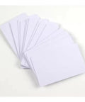 Cr80 Pvc Blank Id Cards No Chip Bulk Lot Compatible With Zebra Fargo Evolis Datacard Idp Printers smooth blank cards in a stack.