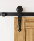 Black Rustic Sliding Barn Door Hardware Kit For Two Doors 13 Foot Flat Track System With Arrow Design Rollers in close-up view