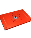 Premium Aluminum Alloy Router Table Insert Plate Built Like A Legend With Heavy Duty Components And Pro Shop Ready Grip view from above showing red surface and center hole.