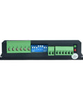 DM556T digital stepper driver module, front view; blue DIP switches with green terminal blocks.
