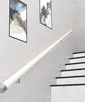 Sleek White Wooden Stair Banister Kit Wall Mounted Handrail For Interior Steps Heavy Duty Safety Grab Rail on staircase wall.