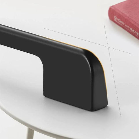 Close-up of Five Pack Solid Black Long Cabinet Handles Five Point Eight Three Inch Drawer Pulls on a white surface.