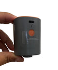 Relime portable mini vacuum pump, side view, gray body with orange button and USB-C port for vacuum bags