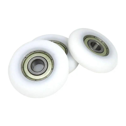 Four Piece Set Of Eight Millimeter Bore Forty Millimeter Outer Diameter Replacement Rowing Machine Seat Rollers Pom Coated Spherical Pulleys close-up.