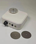 Mini Cordless Electric Flat Grinding And Polishing Machine With Interchangeable Diamond Pads For A Slick Cut and Zero Sweat, showing white aluminum body and two diamond pads.