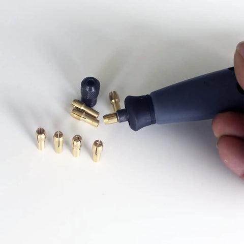 Five Piece Copper Drill Chuck Collet Bits Set 1mm For Dremel Rotary Tools, visible with copper bits and rotary tool
