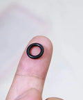 Durable Silicone Wacky Rig O Rings For 4 To 5 Inch Senko Worms Elastic Rings That Prevent Tears Keeps Baits Secure And Let Soft Plastics Fall Naturally Includes 100 Rings And Tackle Box Storage For Easy Fishing Setup black ring on fingertip