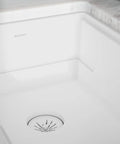 Quartz Color Matched Disposer Flange With Removable Basket Strainer and Rubber Stopper 3-1/2 Inch Polymer Drain installed in sink