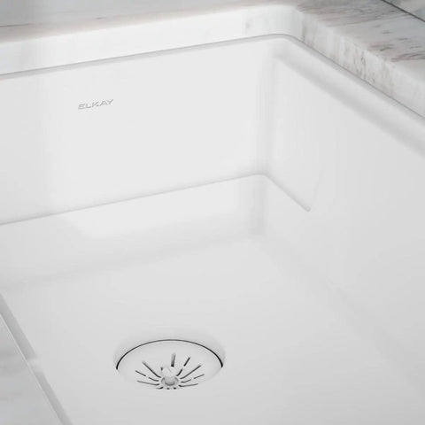 Quartz Color Matched Disposer Flange With Removable Basket Strainer and Rubber Stopper 3-1/2 Inch Polymer Drain installed in sink