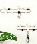 Dope Gold or Black Iron Wall Hook Shelf Decorative Rack for Keys Coats and Hats Perfect for Front Door Entryway to Spice up Your Home with a Trendy Vibe that Slays Every Time, featuring a stylish design with hooks and decor.