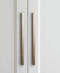 Six Pack Of 5 Inch Champagne Bronze Knurled Cabinet Pulls For Drawers And Dressers With No Slip Grip And Industrial Chic Style From Goo-Ki, Durable Textured Diamond Knurl Hardware, shown installed on white cabinets.