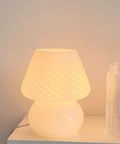 Mushroom Glass Desk Lamp With White Stripes, Vintage Murano Hand-Blown Style, glowing on a side table, perfect for modern decor.