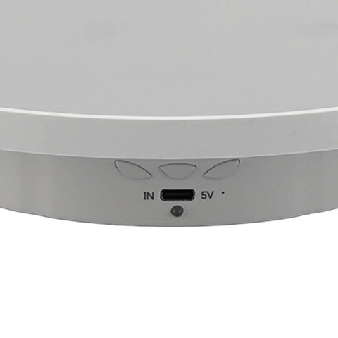 Showing the connection interface of a white electric turntable for jewelry displays featuring 360 degree glass rotation.
