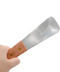 Heavy Duty Ice Cream Spade With Wooden Handle Stainless Steel Dessert Shovel For Scooping Ice Cream And Cutting Butter in hand
