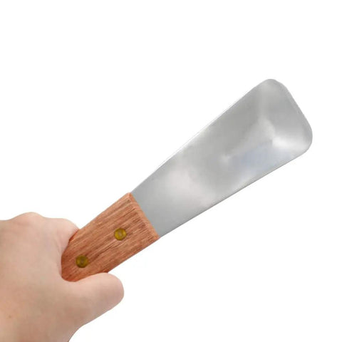 Heavy Duty Ice Cream Spade With Wooden Handle Stainless Steel Dessert Shovel For Scooping Ice Cream And Cutting Butter in hand