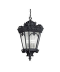 Victorian 4 Light Outdoor Pendant Light In Textured Black Finish With Clear Seeded Glass Panels hanging from a chain, showcasing ornate detailing.