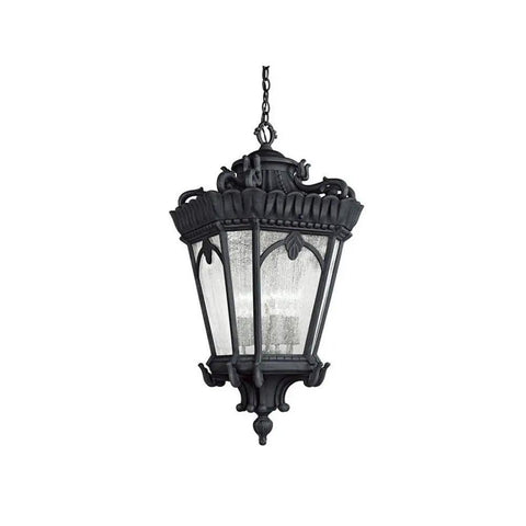 Victorian 4 Light Outdoor Pendant Light In Textured Black Finish With Clear Seeded Glass Panels hanging from a chain, showcasing ornate detailing.