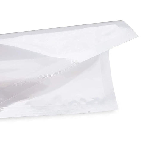 Close-up of Clear 6x10 Inch 3 Mil Chamber Vacuum Sealer Bags with tear notch, BPA-Free pre-cut pouches, showing sealed edge