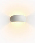 Ring Wall Sconce, Modern Minimalist LED Wall Light with PC Shade, sleek white design illuminating a wall.