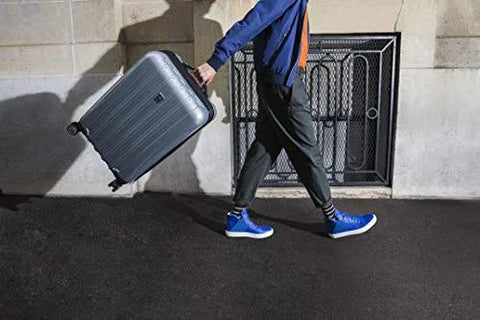 Side view of a brushed charcoal Delsey Paris Helium Aero hardside luggage, 24-inch, with spinner wheels