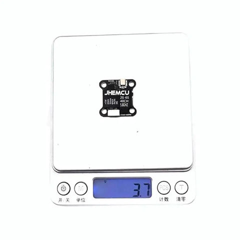 Ultra Light 40CH FPV Transmitter With 20x20mm Mount, Adjustable 25-600mW VTX on digital scale showing 3.7 grams