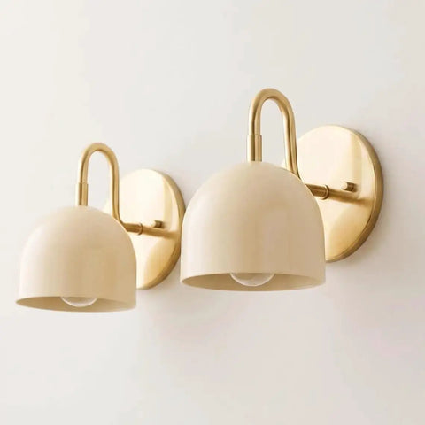 Modern Brass Bowl Wall Sconce - Mid Century Modern Light Fixture Pair (Set of 2) with beige shades attached to a wall.