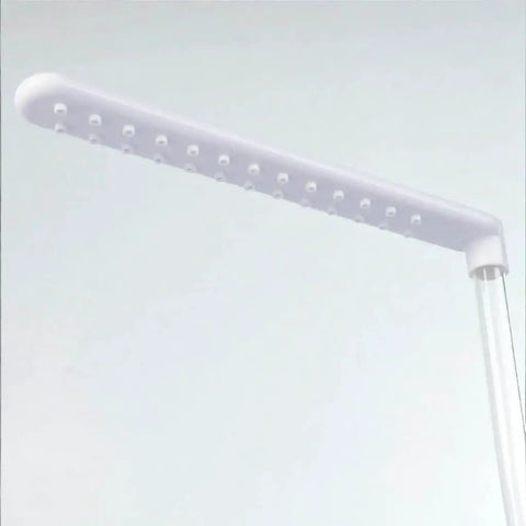 Close-up of white plastic shower head for Automatic Bird Bath Shower With Pump For Parrots And Small Birds, Quiet Running Water Bathing Station.