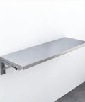 Foldable Stainless Steel Wall Mount Storage Shelf And Fold Down Table for kitchen bathroom balcony, extends and flips flat to save space.