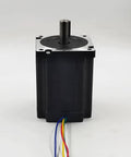 Front view of black Nema 34 stepper motor with silver mounting flange, protruding shaft and colored wires.